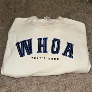 Champion WOAH That’s Good crewneck. From Sadie Robinson’s podcast.